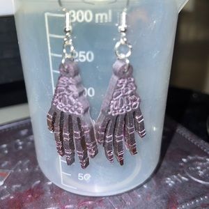 Purple resin skeleton hands